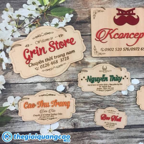 Bảng hiệu nh&agrave; may nền gỗ khắc laser